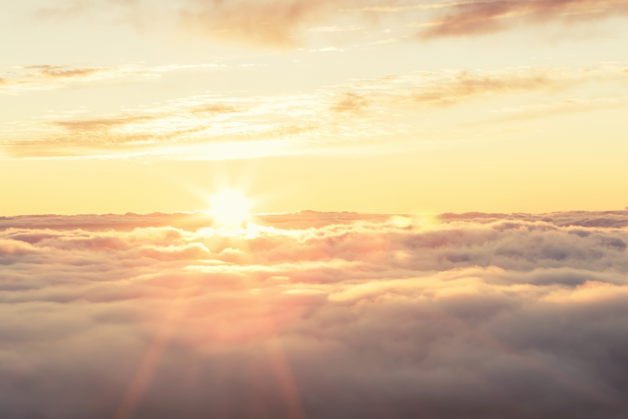 Majestic sunset above soft clouds in the Canary Islands, Spain