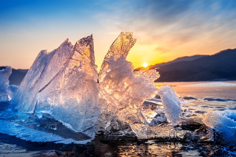 Very large and beautiful chunk of Ice at Sunrise in winter.